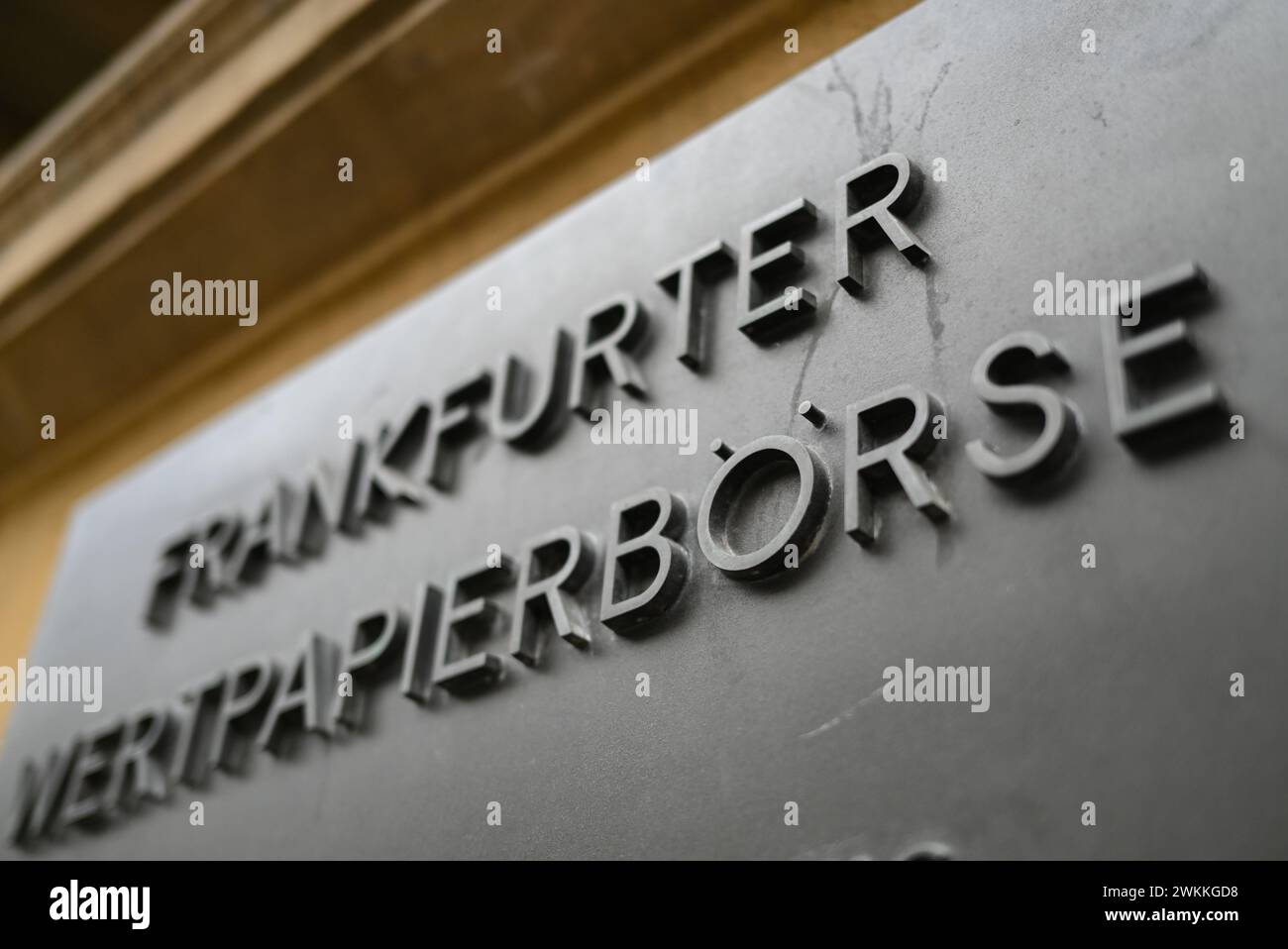 PRODUCTION - 21 February 2024, Hesse, Frankfurt/Main: A metal plate with the inscription 'Frankfurter Wertpapierbörse' is attached to the façade in front of the Frankfurt Stock Exchange. Photo: Arne Dedert/dpa Stock Photo