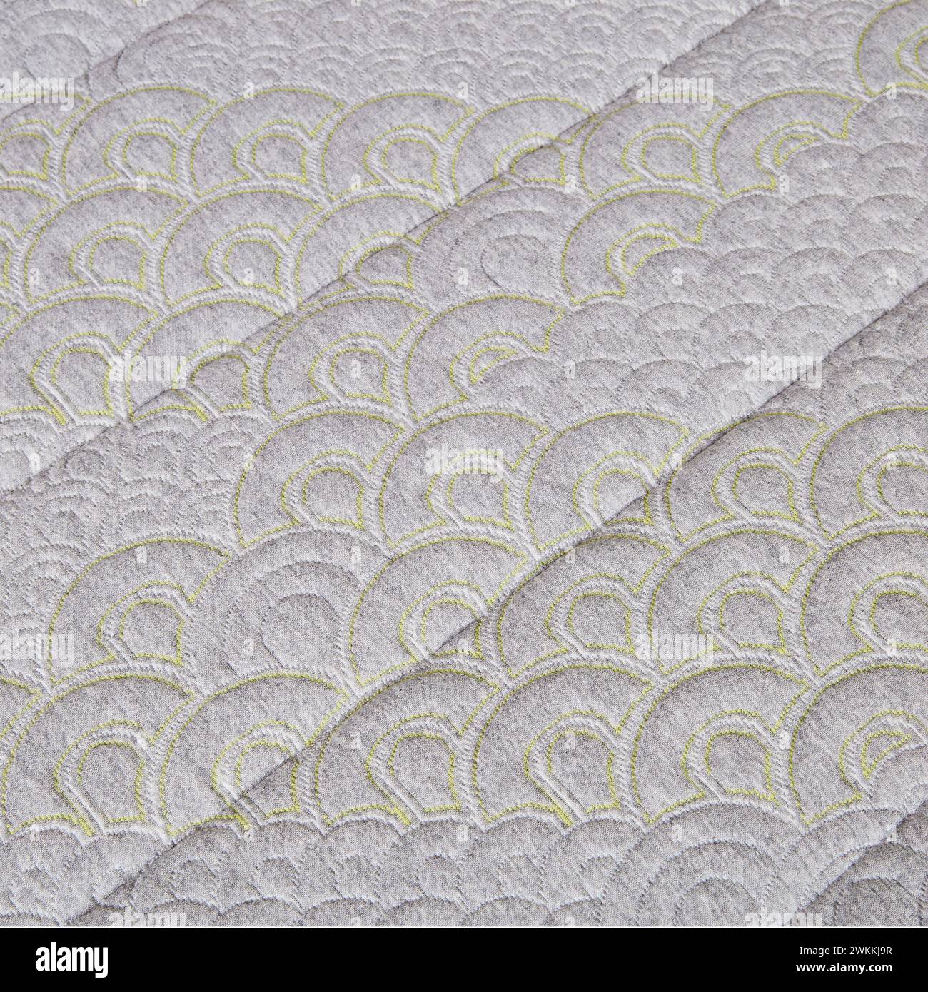 Luxury Scalloped Fabric Detail with Chartreuse Stitching Stock Photo