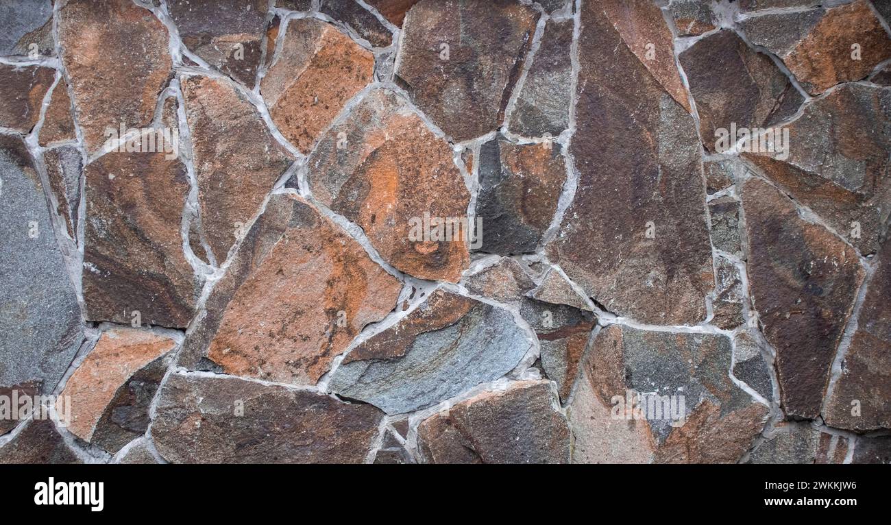 House wall made from rocks background Stock Photo - Alamy