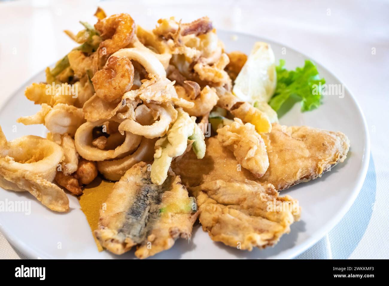 Mixed deep-fried fish, shrimp and squid platter Stock Photo