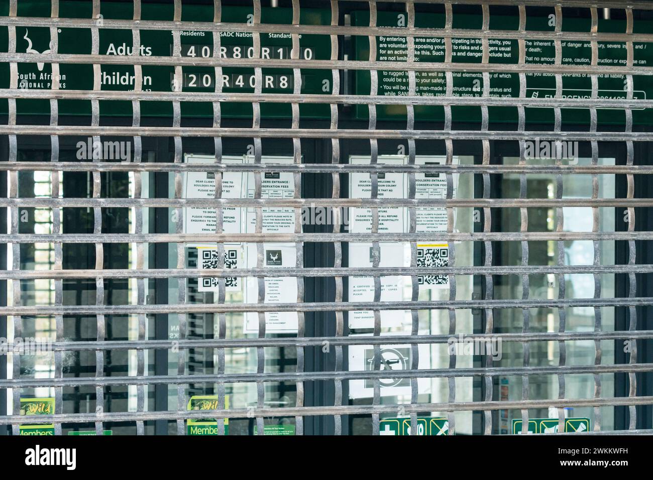 metal grid showing closed ticket office at Sanparks Boulders beach nature reserve during Covid pandemic concept downturn in economics in South Africa Stock Photo