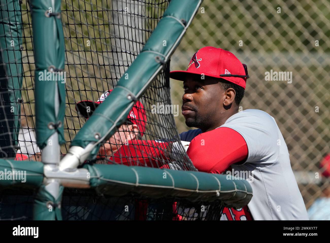 St. Louis Cardinals' Jordan Walker leans against a batting cage during