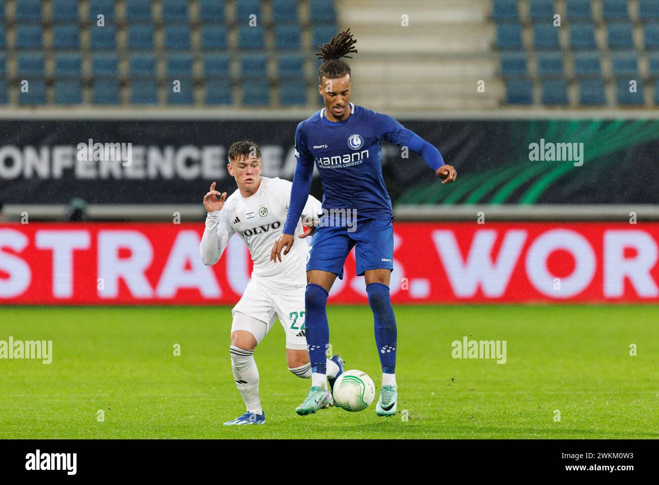 Maccabi's Ilay Feingold and Gent's Archibald Archie Brown fight for the