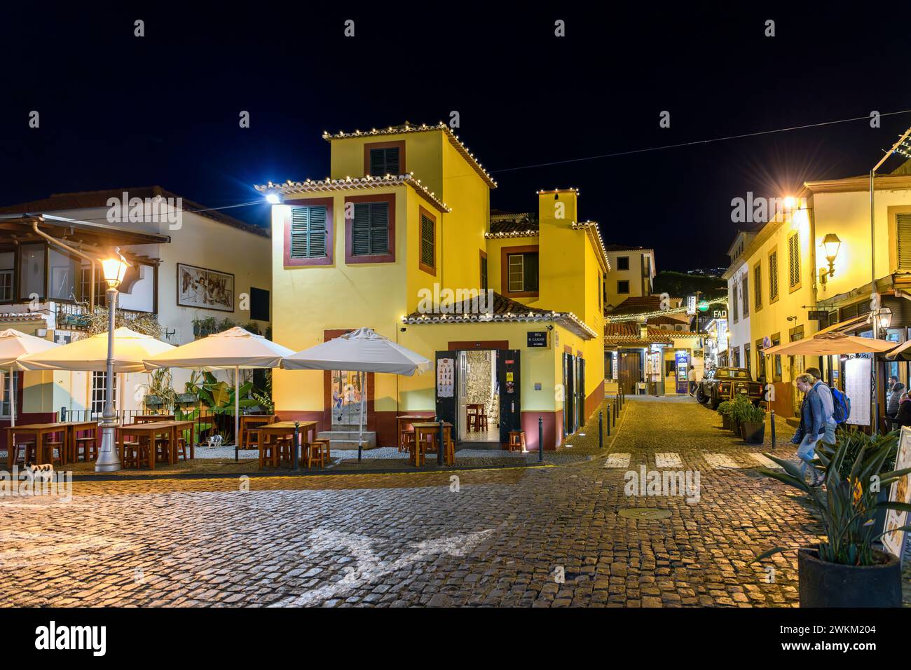 An illuminated Rua de Santa Maria in the historic old town of Funchal, Portugal, on the Canary Island of Madeira. Stock Photo