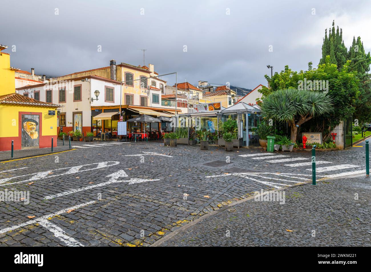 The famous Rua de Santa Maria narrow street of cafes, colorful doors and shops in the historic medieval old town of Funchal, Madeira Portugal. Stock Photo