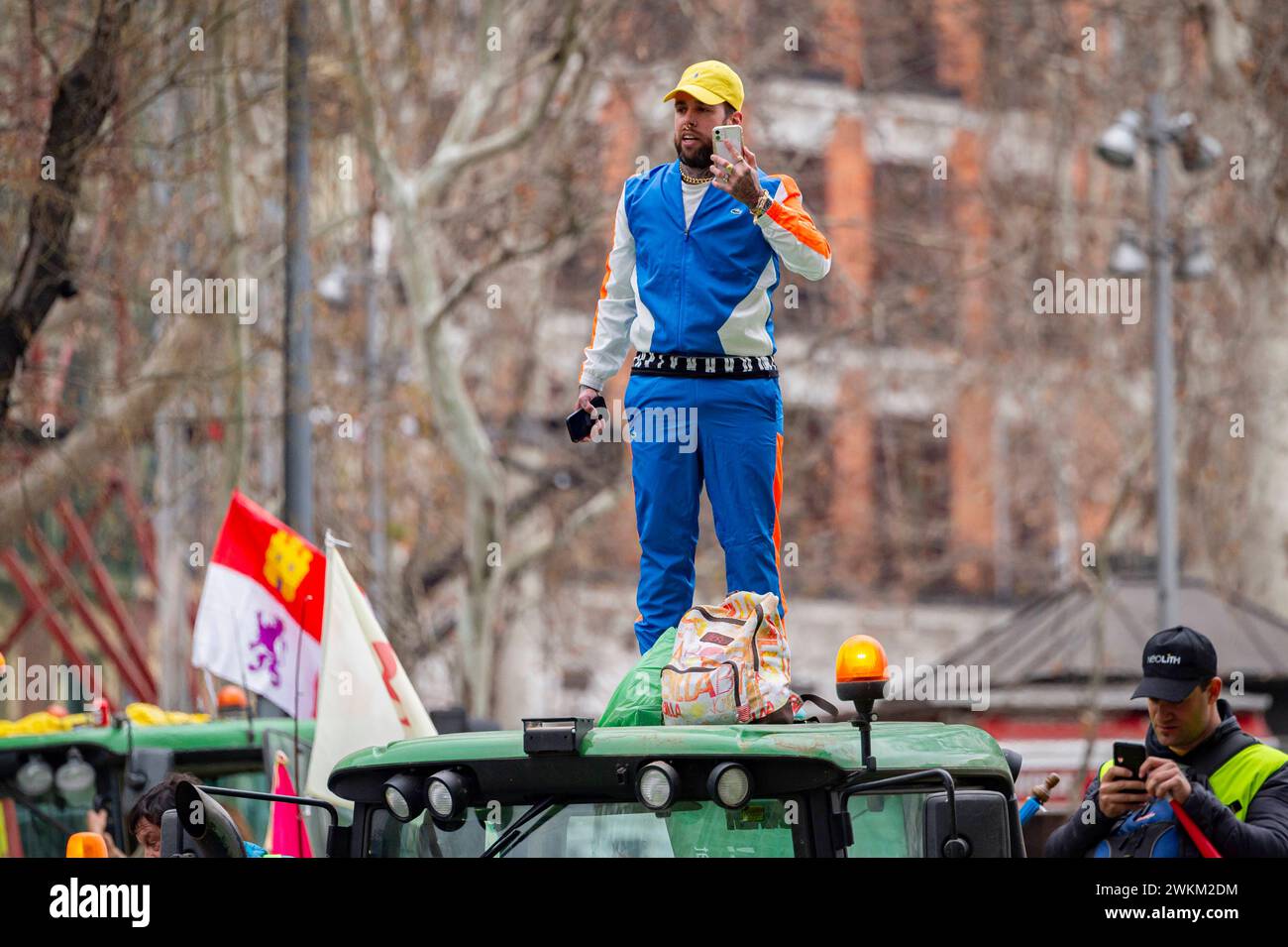 Spanish farmer demonstration in Madrid A protester seen on the top of a tractor during the farmers demonstration in Madrid the protest, organized by Spanish trade unions, is focused on concerns over unfair competition from products originating outside the EU. Farmers are also unhappy about the meager profits derived from their crops and are critical of EU agricultural policy. Madrid Puerta de Alcala Madrid Spain Copyright: xAlbertoxGardinx AGardin 20240221 manifestacion tractores madrid 141 Stock Photo