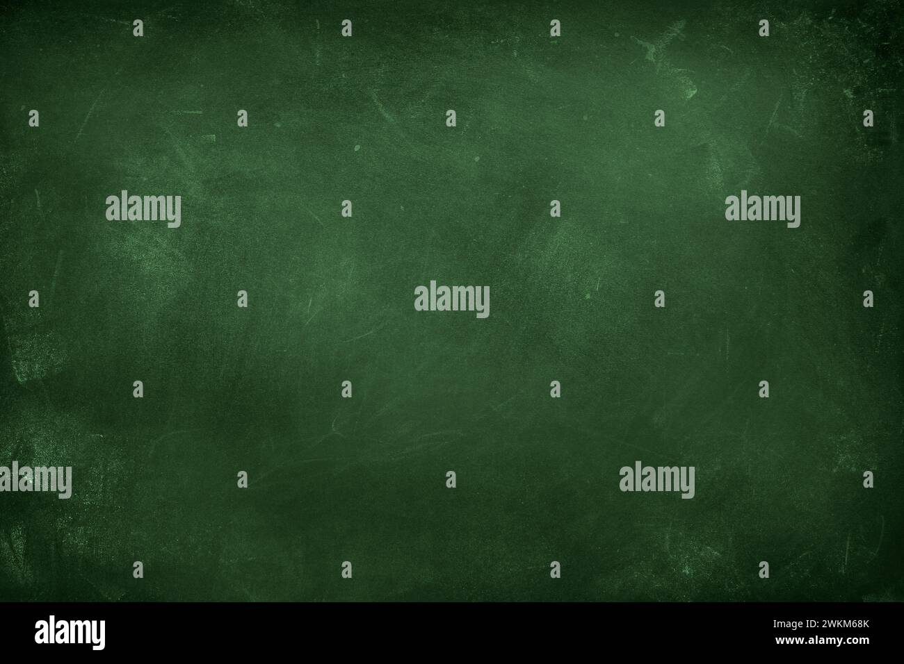 Chalk rubbed out on green chalkboard background Stock Photo