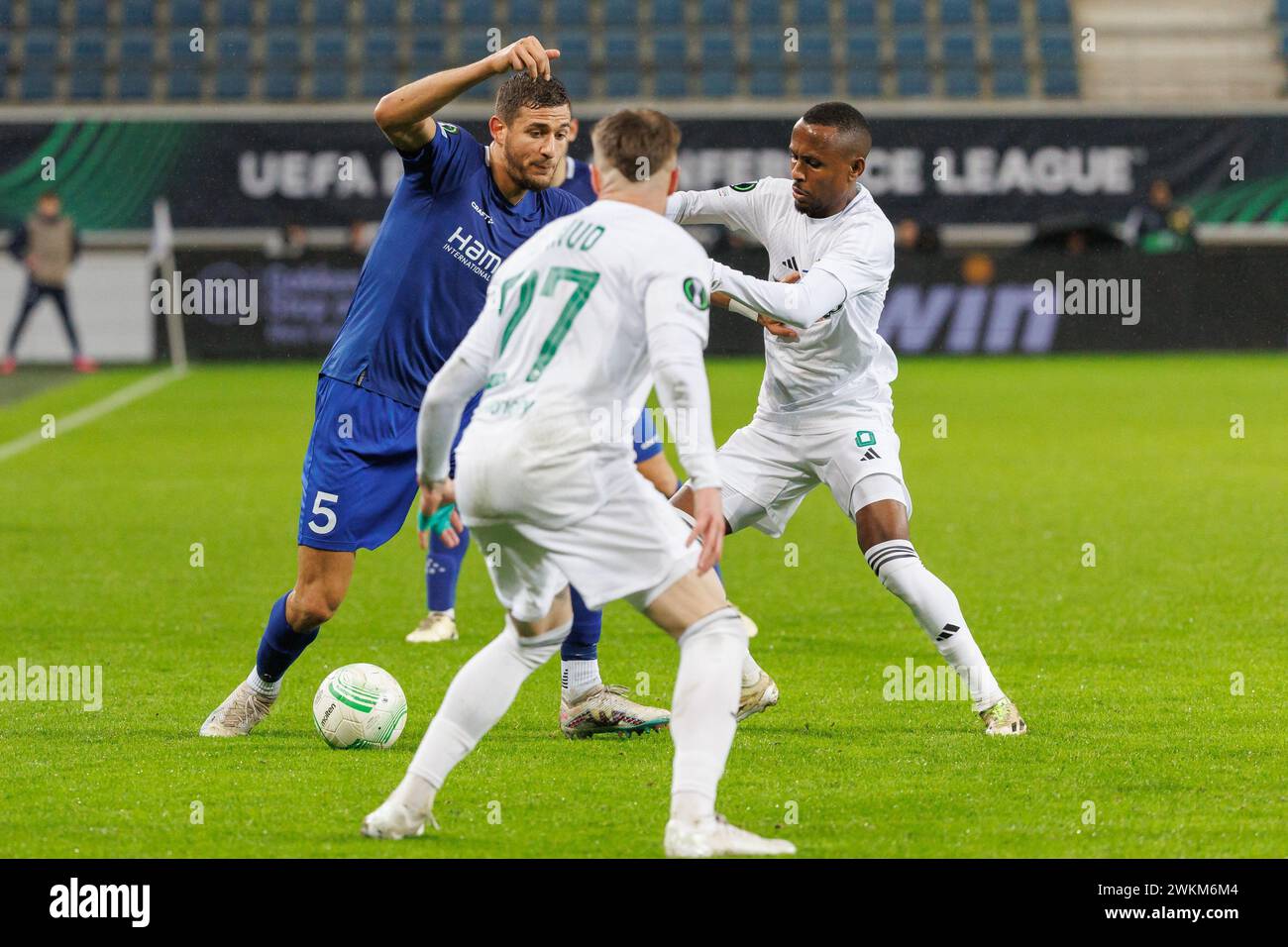 Gent, Belgium. 21st Feb, 2024. Gent's Ismael Kandouss and Maccabi's Gadi Kinda fight for the ball during a soccer match between Belgian KAA Gent and Israeli Maccabi Haifa, on Wednesday 21 February 2024 in Gent, the return leg of the play offs phase of the UEFA Conference League competition. The first leg ended in a 1-0 Maccabi win. BELGA PHOTO KURT DESPLENTER Credit: Belga News Agency/Alamy Live News Stock Photo