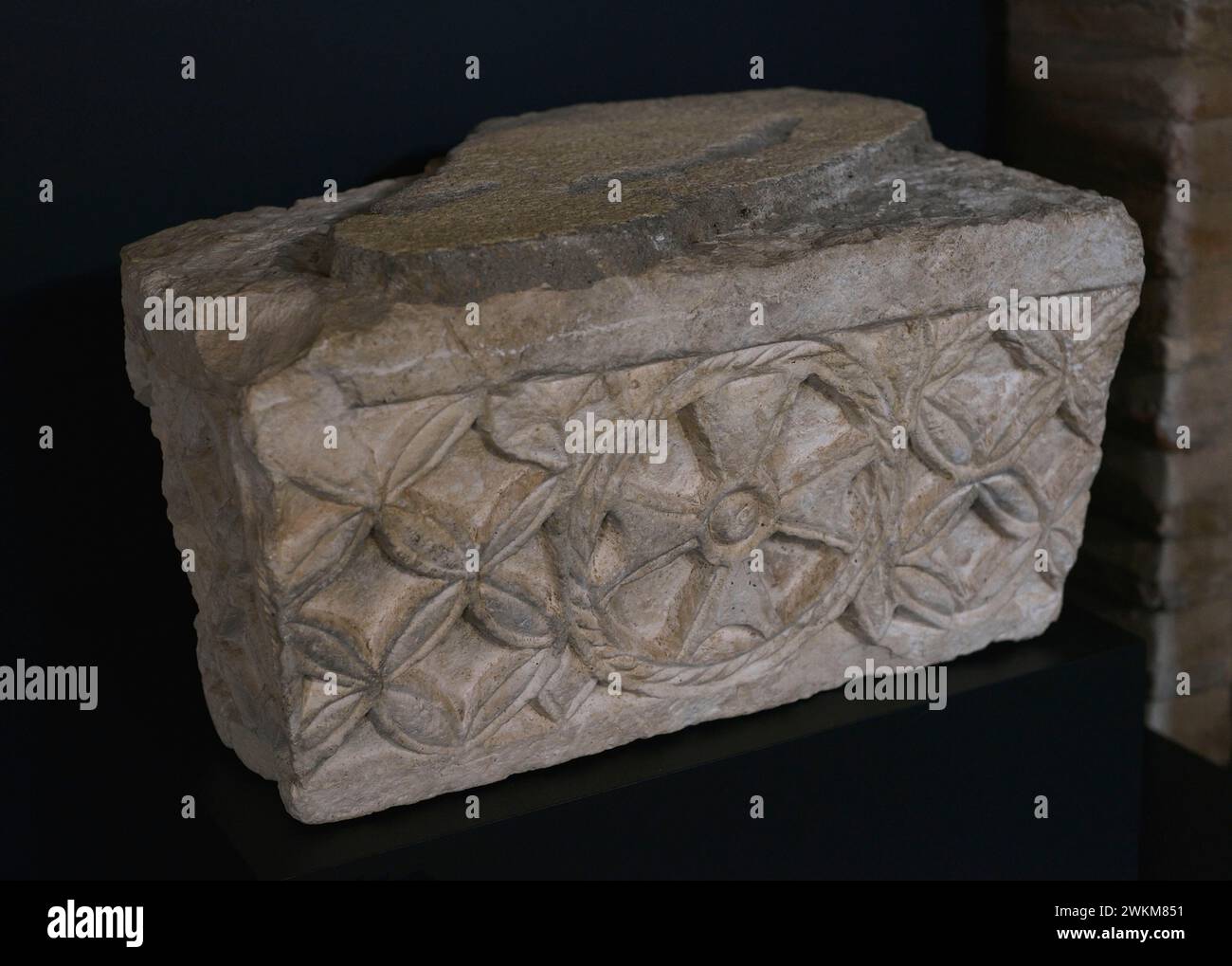 Frieze decorated with a cross pattée with a central button. Limestone ...