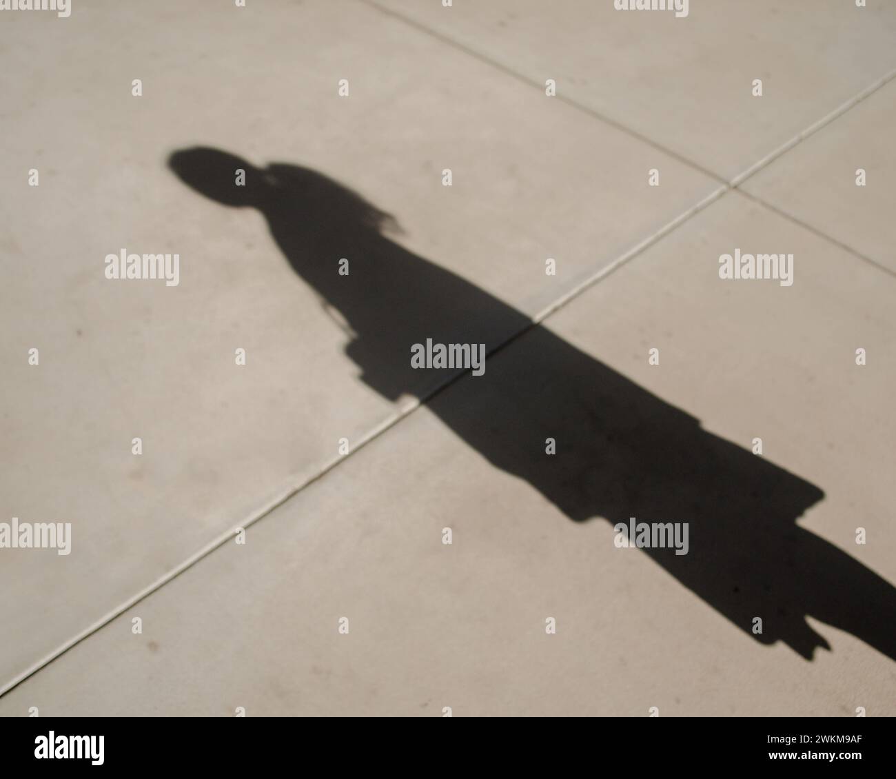 Woman's Shadow on the ground Stock Photo