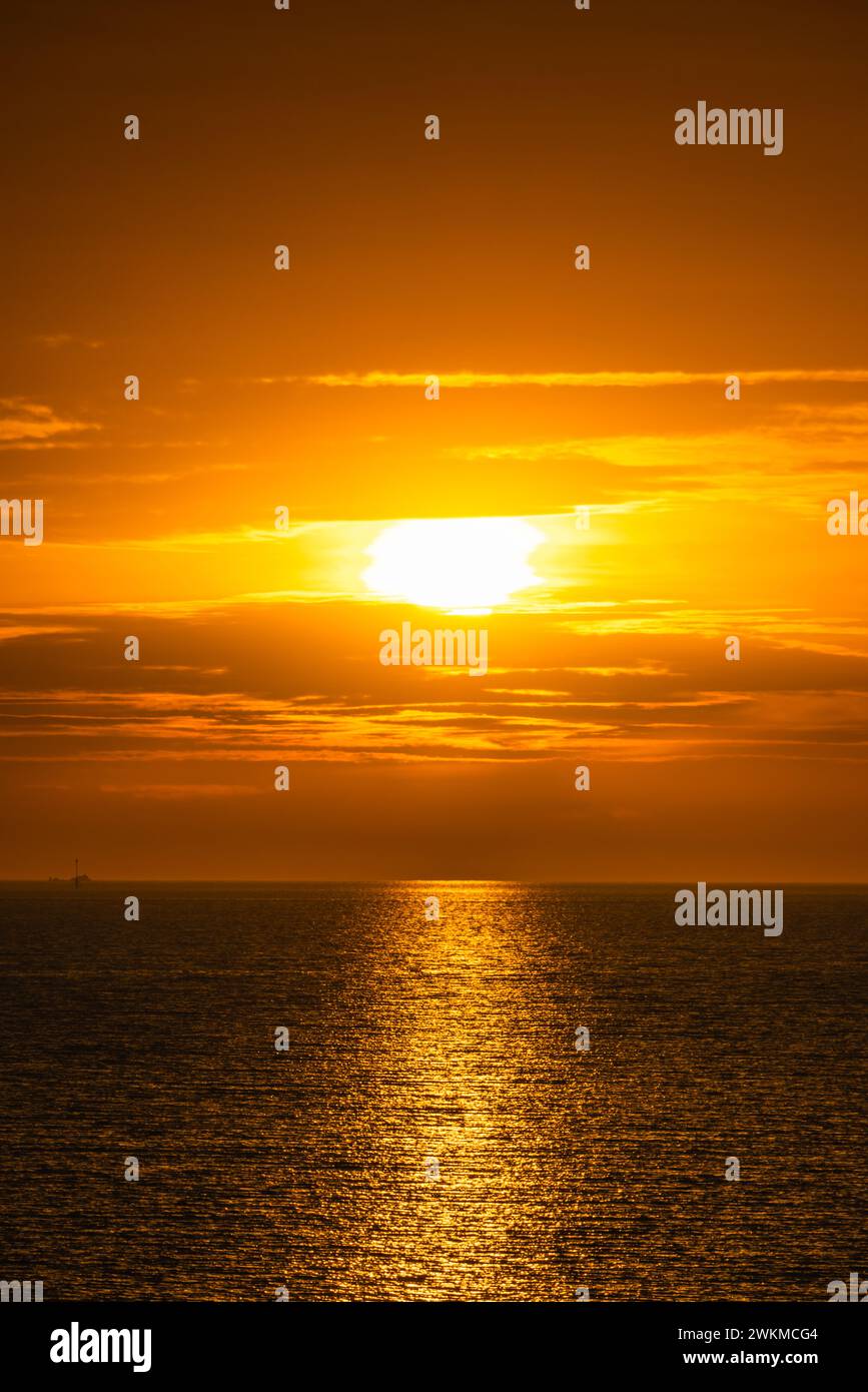 Sunrise over low lying clouds above the ocean Stock Photo Alamy