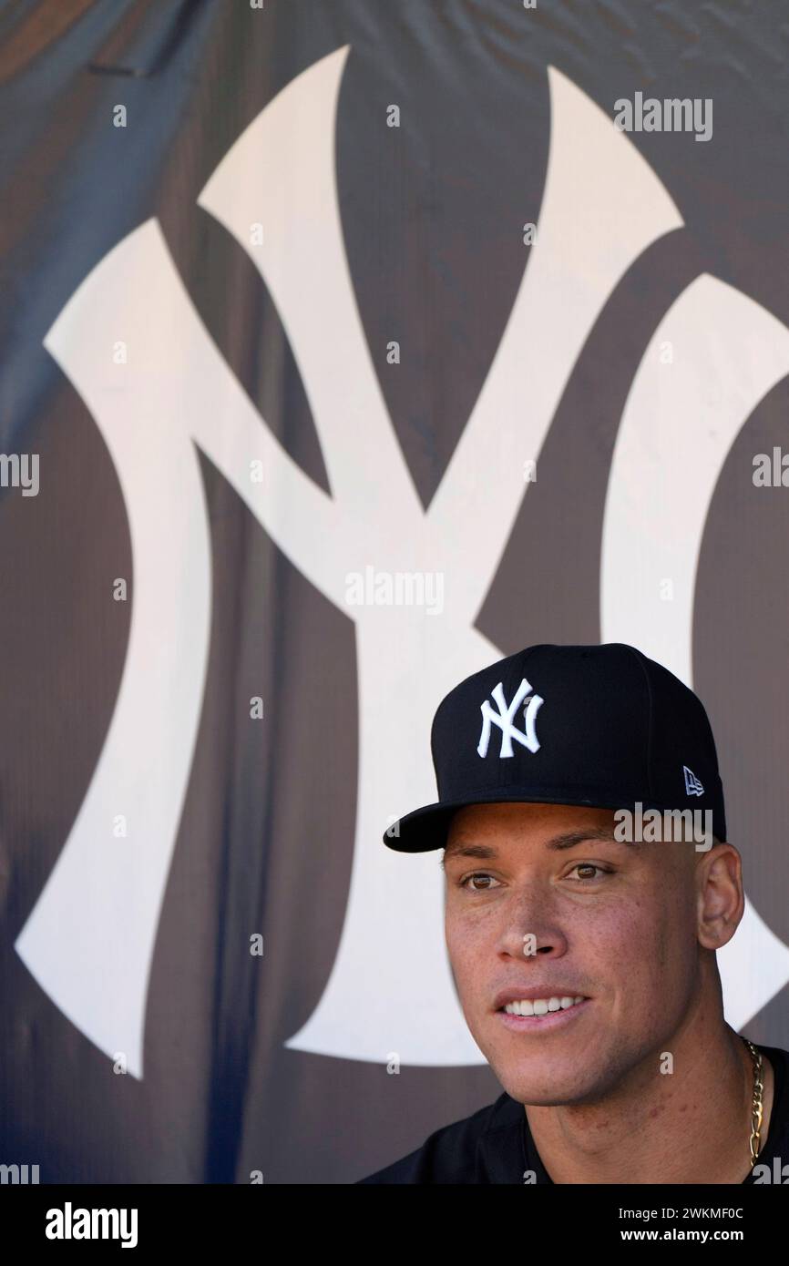 New York Yankees right fielder Aaron Judge sits in the dugout during a baseball spring training