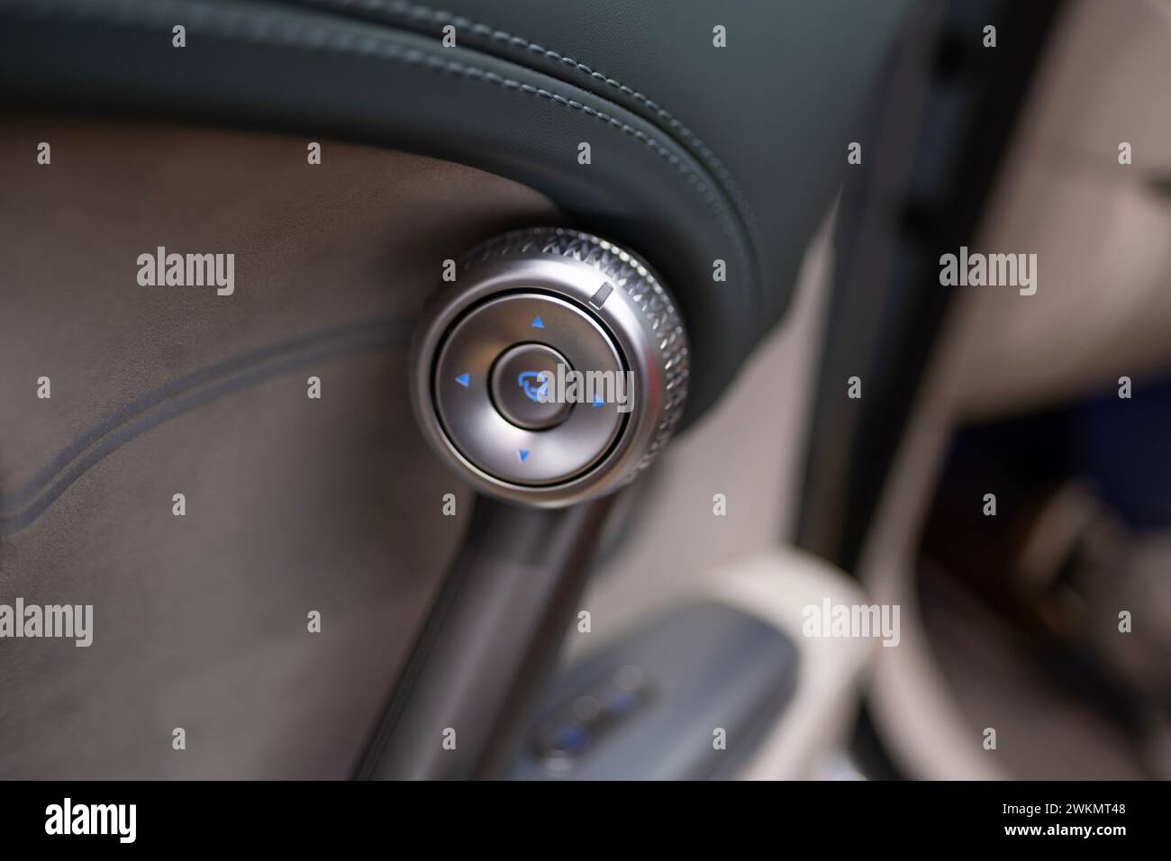 sound system controls on driver's door, Interior of Genesis GV60 Electric Car, instruments physical button switches, joysticks, SUV korean brand Hyund Stock Photo