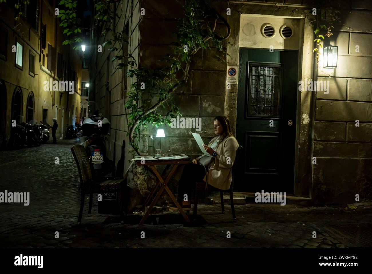 Dining as night falls on a side street in Rome near the Pantheon. Stock Photo