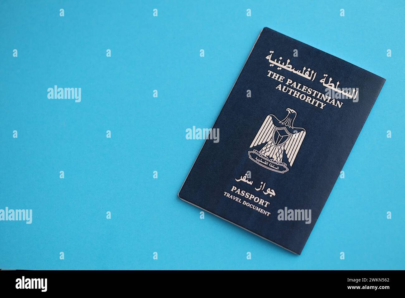 Blue Palestinian Authority passport on blue background close up