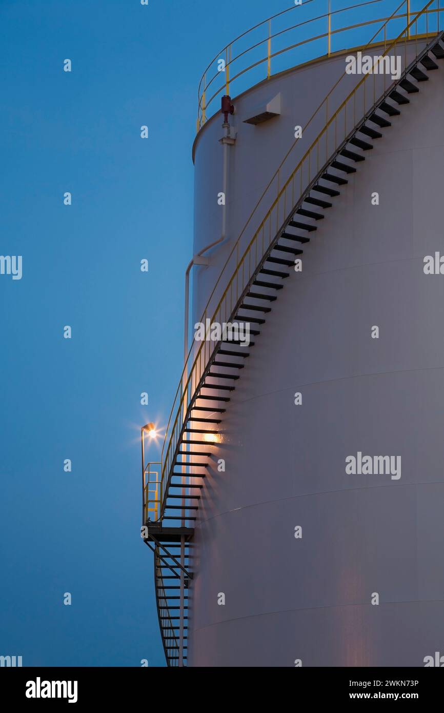 Storage tank at an oil and gas refinery at dusk, Montreal East, Quebec ...