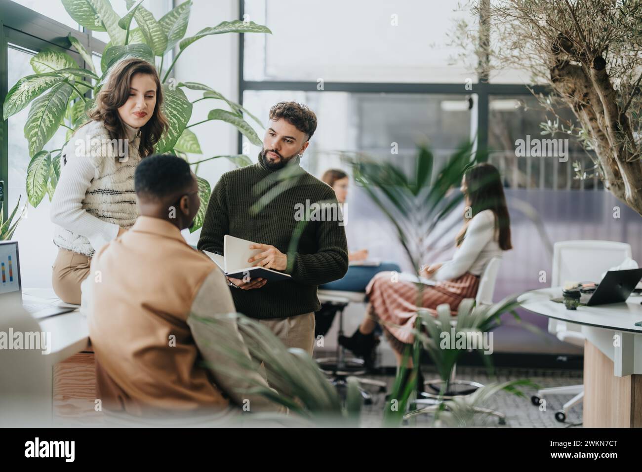 Diverse professionals collaborating in a modern office for project ...