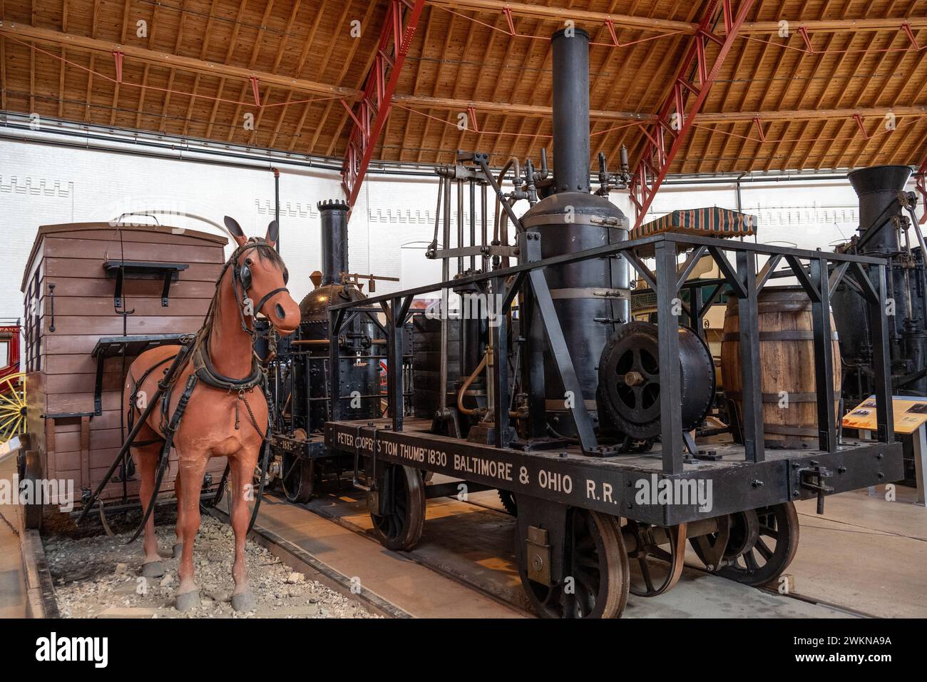 Replica of a race between a horse pulled wagon and the 