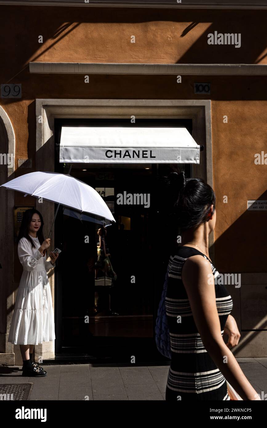 Daily life in Italy where patrons line up to visit high end stores near