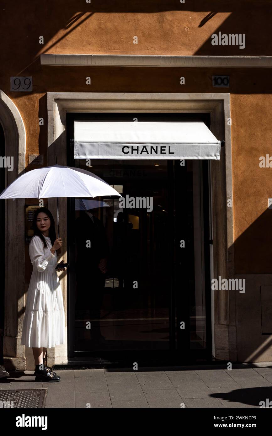 Daily life in Italy where patrons line up to visit high end stores near