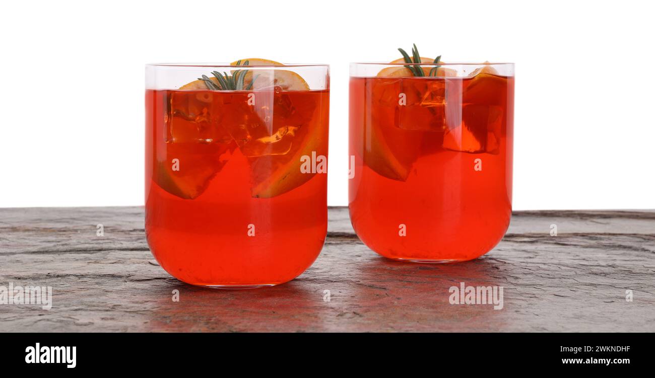 Aperol spritz cocktail, orange slices and rosemary in glasses on grey ...
