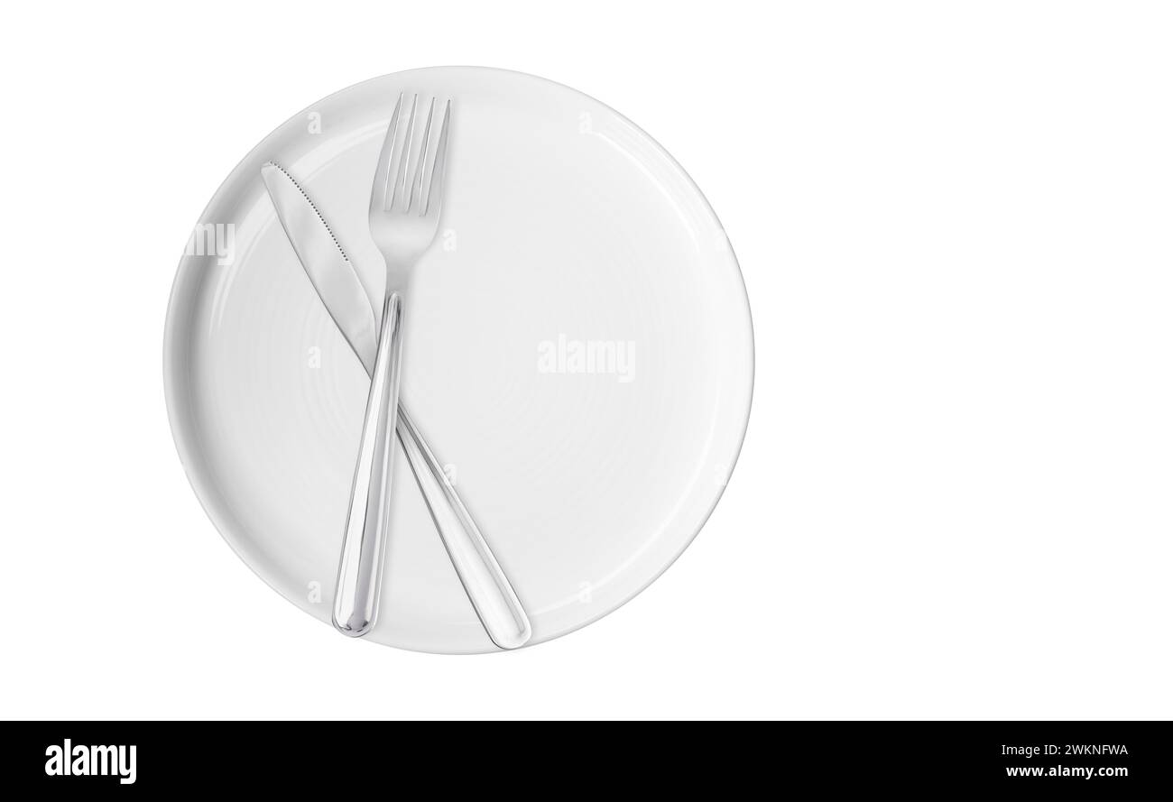 Clean plate, fork and knife on white background, top view Stock Photo ...