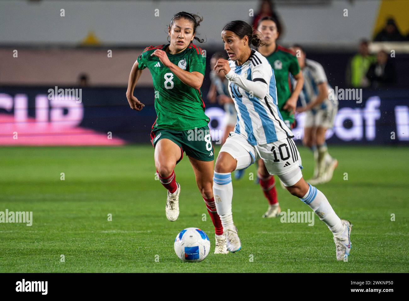 Argentina midfielder Dalila Ippólito (10) is defended by Mexico midfielder Alexia Delgado (8) during the Concacaf W Gold Cup Group A match, Tuesday, F Stock Photo