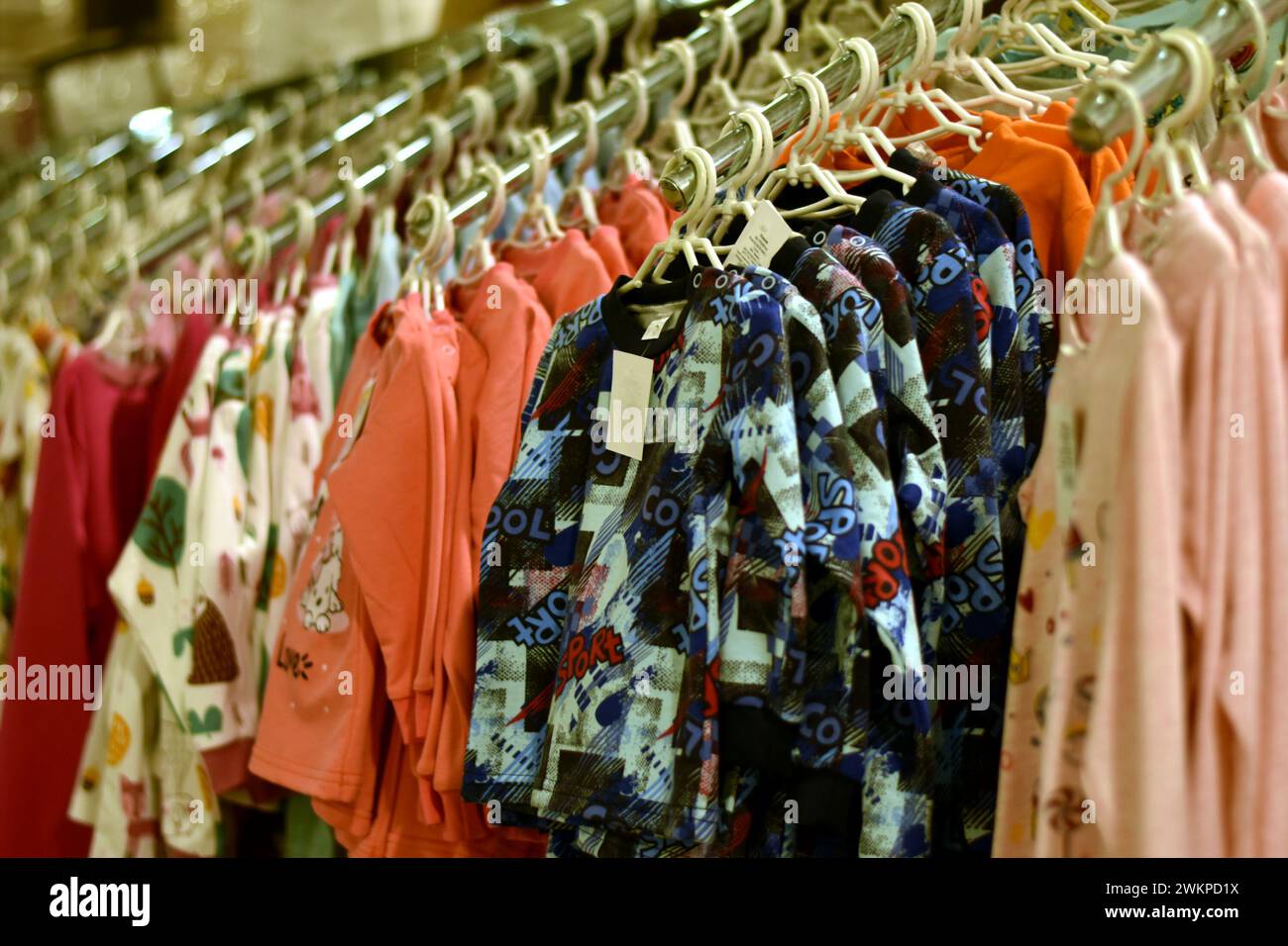 Showcase in a store with children's clothing and blouses. Stock Photo