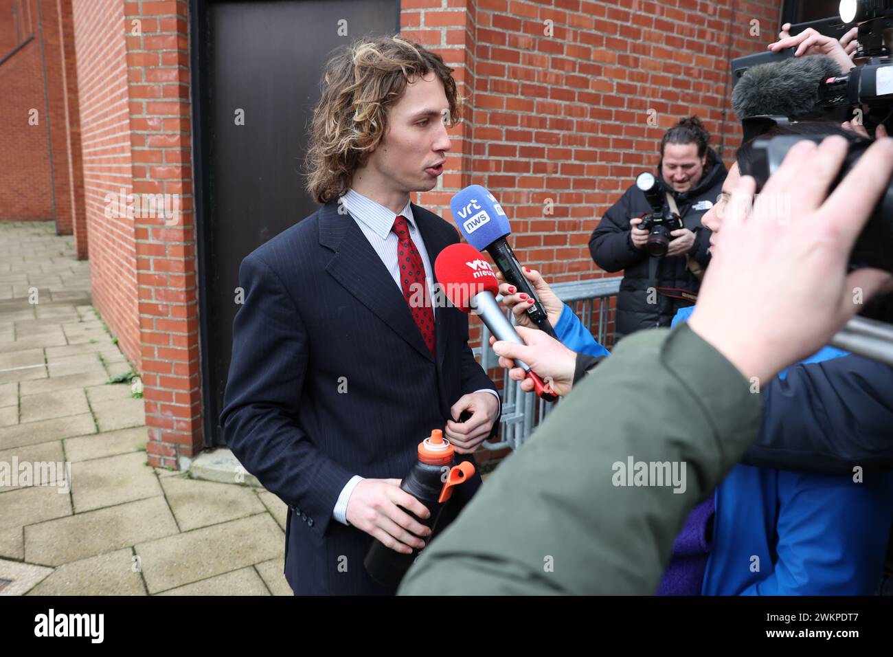 YouTuber Acid (Nathan Vandergunst) arrives for the verdict session in the trial against YouTuber Acid before the Bruges criminal court, in Brugge Thursday 22 February 2024. Vandergunst (24) from Blankenberge was summoned directly by a former member of student association Reuzegom after a controversial video. Acid must answer for, among other things, harassment and slander. This affair started when the well-known YouTuber published a video about the trial and sentencing surrounding the death of Sanda Dia during a baptism of student club Reuzegom. Acid mentioned several Reuzegommers by name and Stock Photo