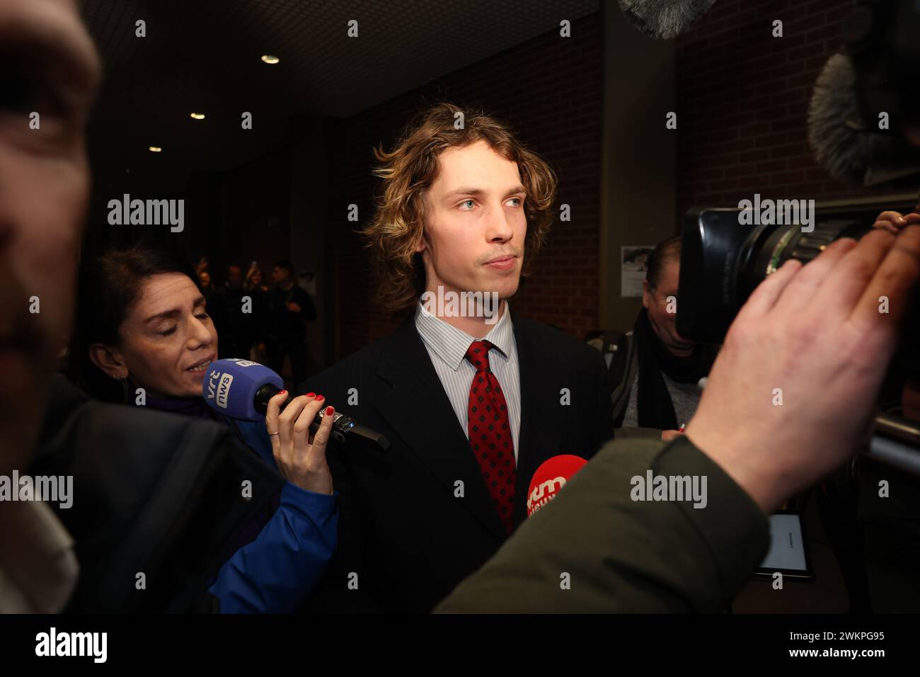 YouTuber Acid (Nathan Vandergunst) talks to the press as he arrives for the verdict session in the trial against YouTuber Acid before the Bruges criminal court, in Brugge Thursday 22 February 2024. Vandergunst (24) from Blankenberge was summoned directly by a former member of student association Reuzegom after a controversial video. Acid must answer for, among other things, harassment and slander. This affair started when the well-known YouTuber published a video about the trial and sentencing surrounding the death of Sanda Dia during a baptism of student club Reuzegom. Acid mentioned several Stock Photo