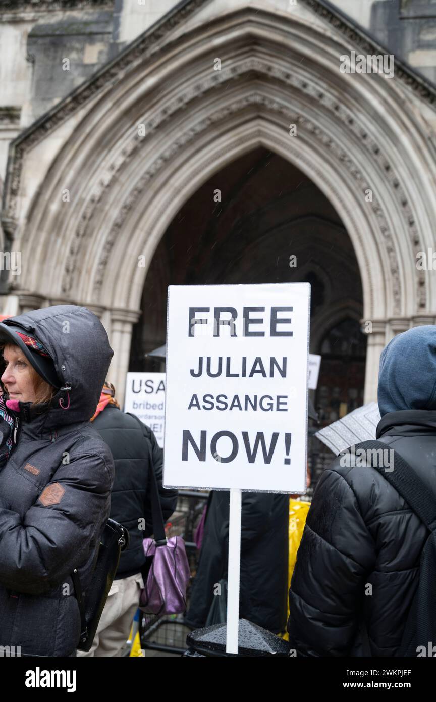Supporters of Wikileaks founder Julian Assange demonstrate outside the Royal Courts of Justice demanding his freedom on the second day of a hearing to Stock Photo