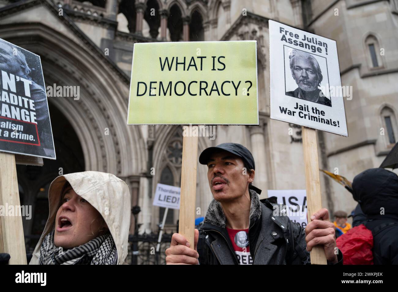 Supporters of Wikileaks founder Julian Assange demonstrate outside the Royal Courts of Justice demanding his freedom on the second day of a hearing to Stock Photo