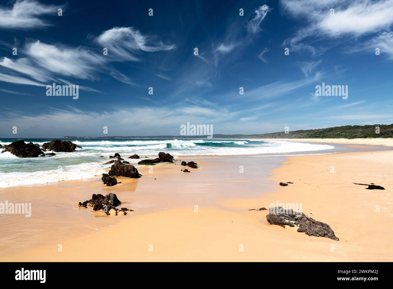 Endless sand at Camel Rock Beach in Bermagui, south of Sydney. Stock Photo