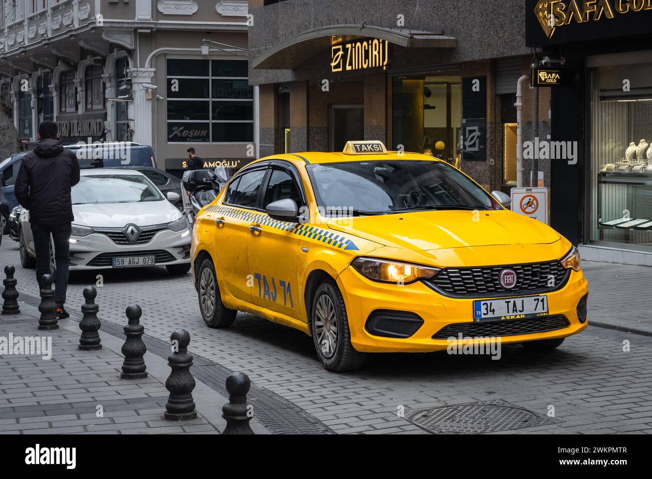 Turkey taxi in Istanbul Turkey. Turkish taxi on the way, Istanbul taxi routes are on duty. Taksi sign. Yellow turkish taxi car-December 22,2023-Travel Stock Photo