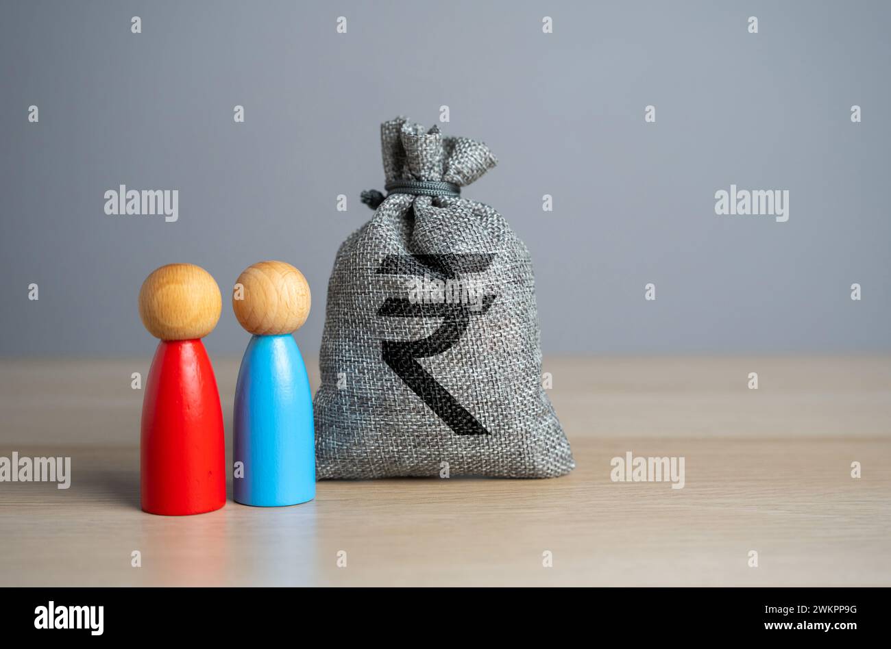 Dispute regarding the division of money. Indian rupee money bag. Resolution of the dispute through the court. Mediation of conflicting parties. Busine Stock Photo