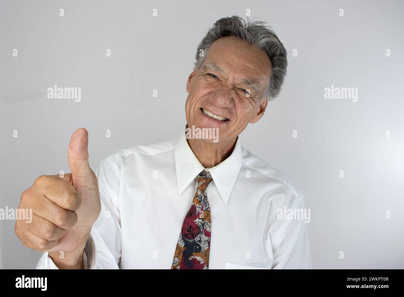 A happy elderly man giving thumbs up Stock Photo - Alamy