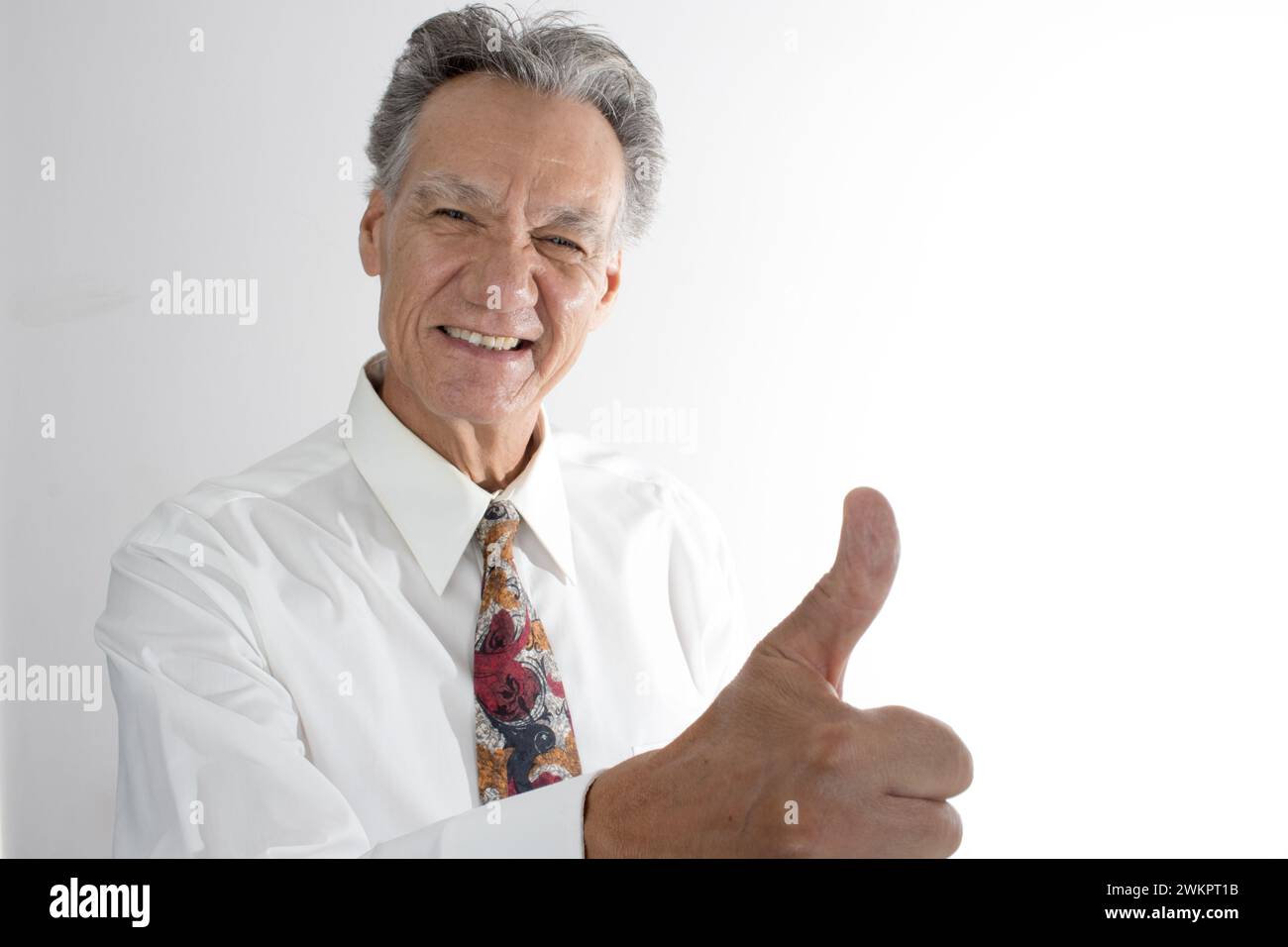 A happy elderly man giving thumbs up Stock Photo