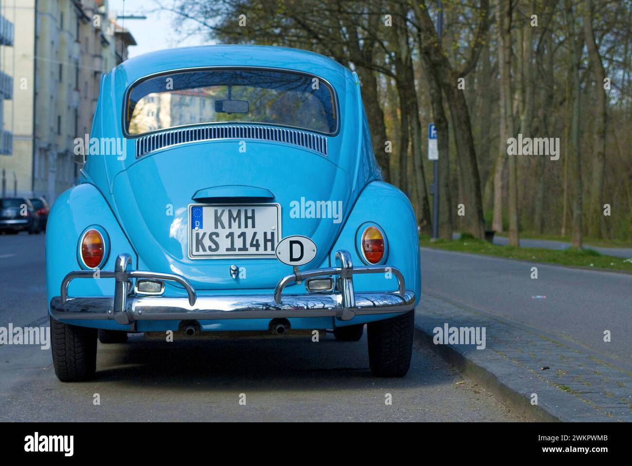 Rear of a light blue VW Volkswagen Beetle parked at the roadside, letters KMH are altered and do not exist in Germany Stock Photo