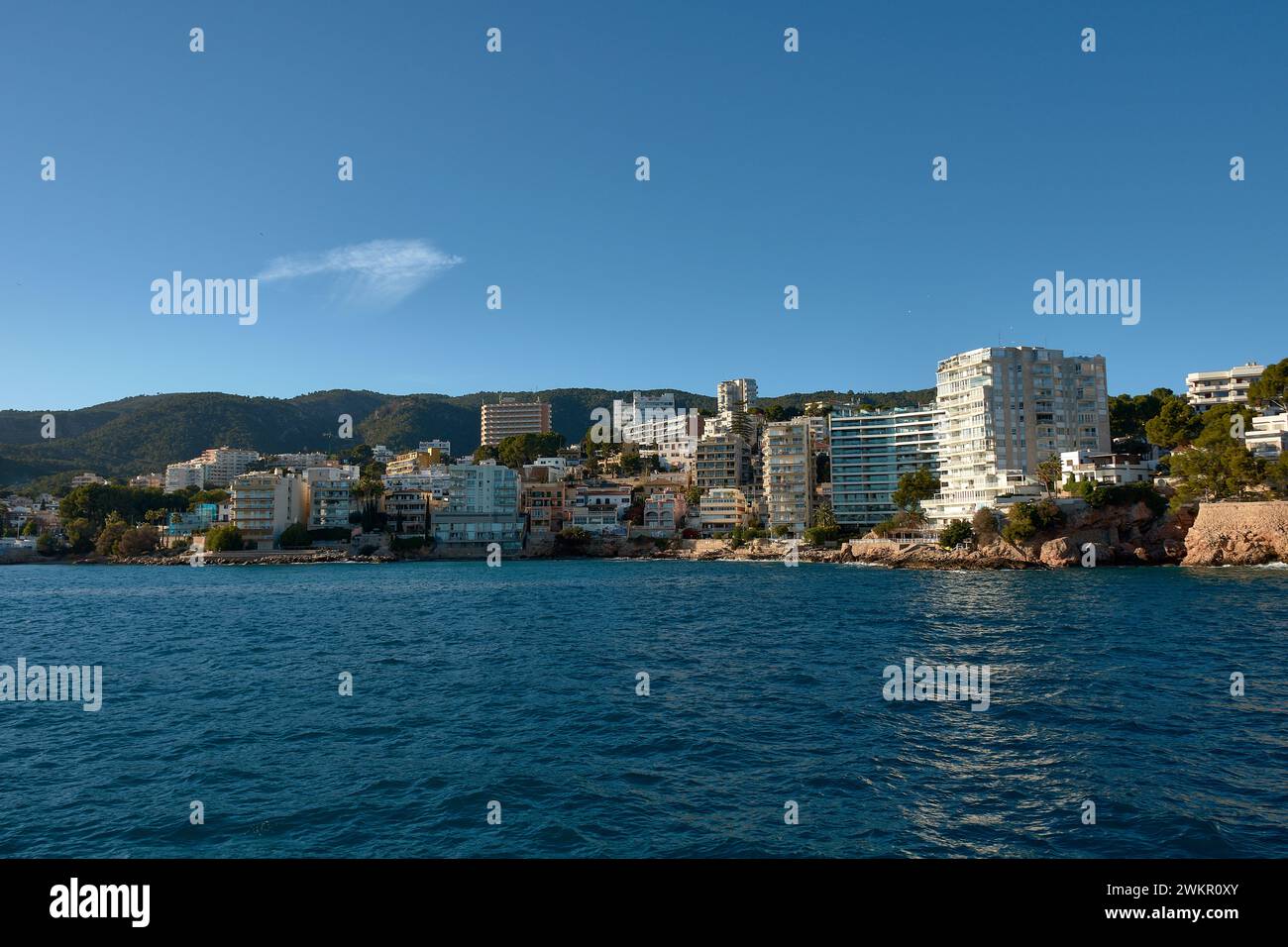 Buildings of the Cala Mayor above the sea on a blue day in Palma de Mallorca, Spain Stock Photo