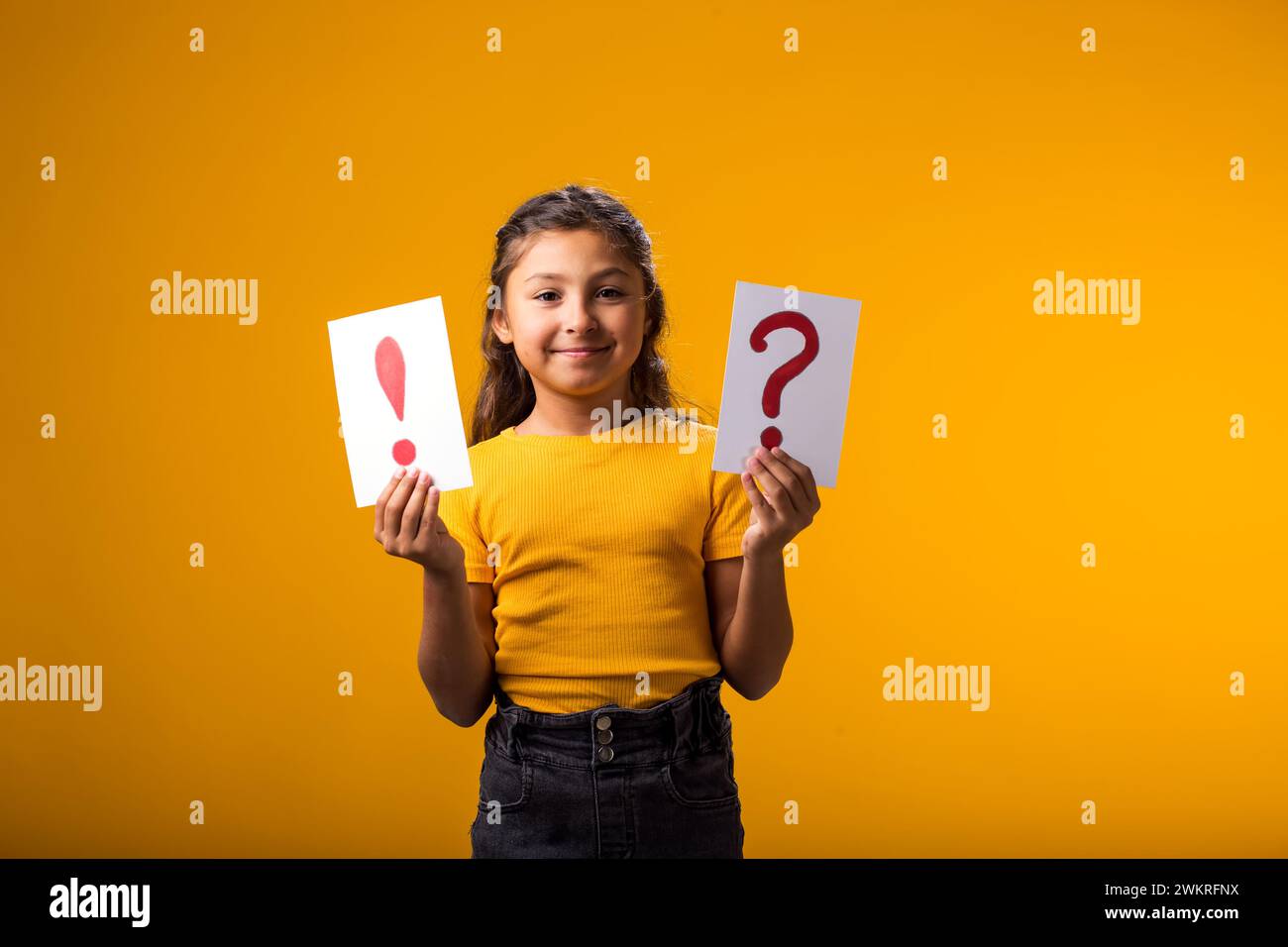Kids Questionpoint A portrait of smiling kid girl holding cards with question mark and ...