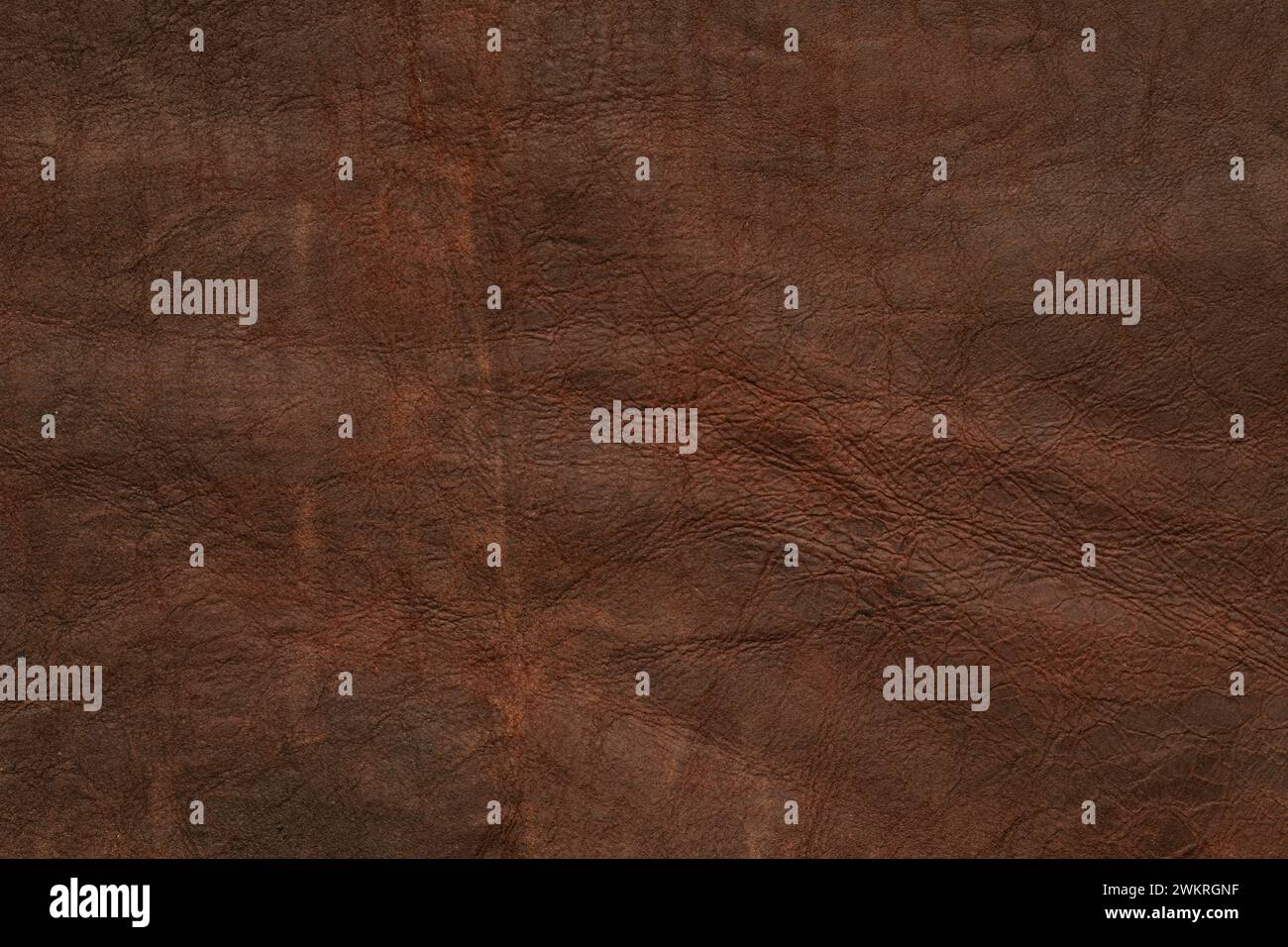 Close-Up Texture of a Brown Leather Surface Showcasing Fine Details Stock Photo