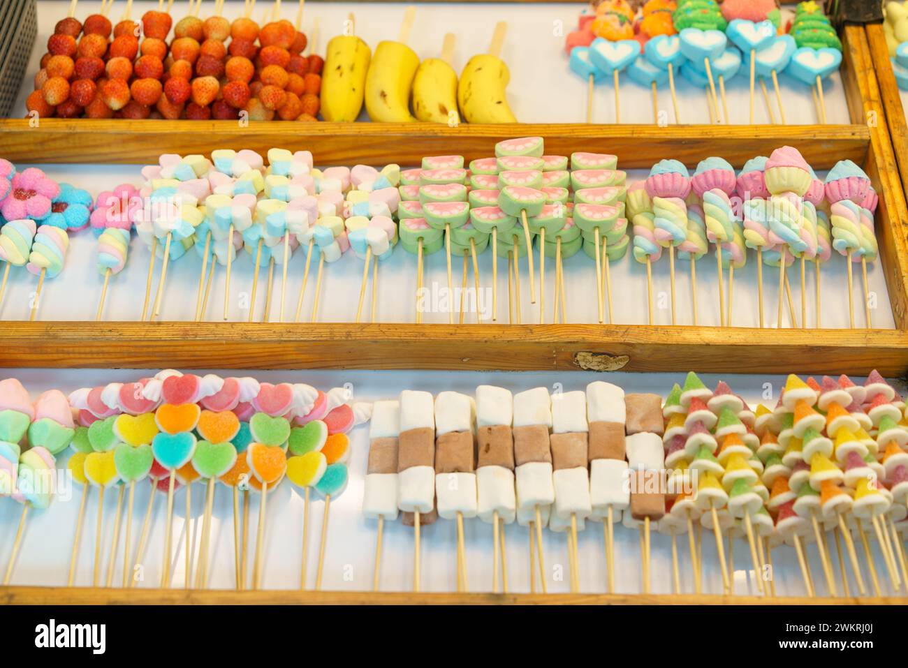 A delightful selection of colorful candy skewers, including