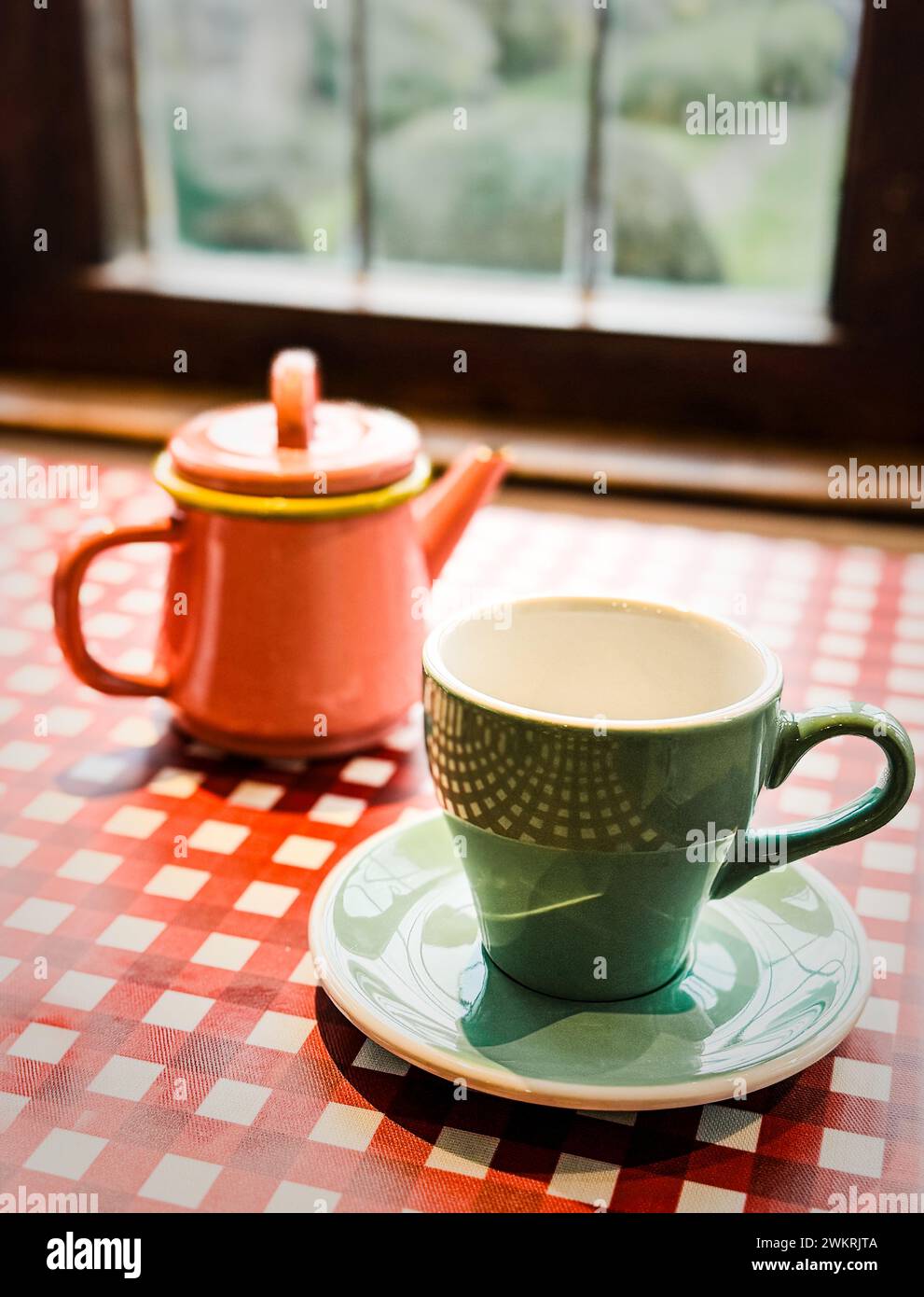 Colourful teapots and crockery in a Cotswolds in England Stock
