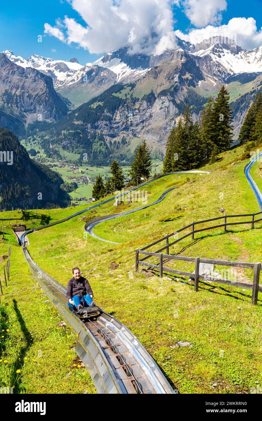 Rodelbahn Oeschinensee toboggan ride on the way to Oeschinen Lake with Kandersteg in the background, Swiss Alps, Switzerland Stock Photo