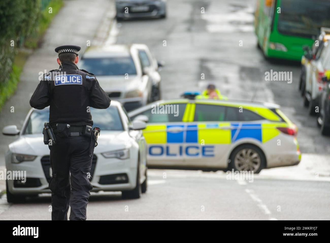 Police officers at a cordon after homes were evacuated when a suspected ...
