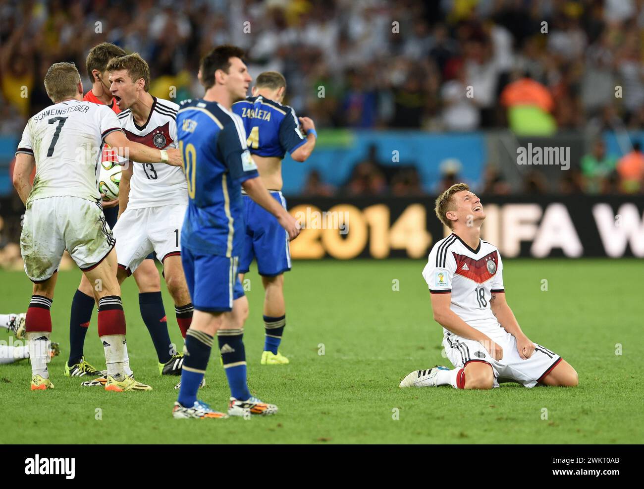 Rio De Janeiro, Brazil. 13th July, 2014. Soccer: World Cup 2014, Final, Argentina - Germany. Germany's Toni Kroos (r) kneels on the pitch after the World Cup victory. Around three years after his retirement, Toni Kroos will be back in action for the German national soccer team. Following a request from national coach Nagelsmann, he will 'play for Germany again from March', the 34-year-old Real Madrid midfielder announced on Instagram. Credit: dpa/Alamy Live News Stock Photo