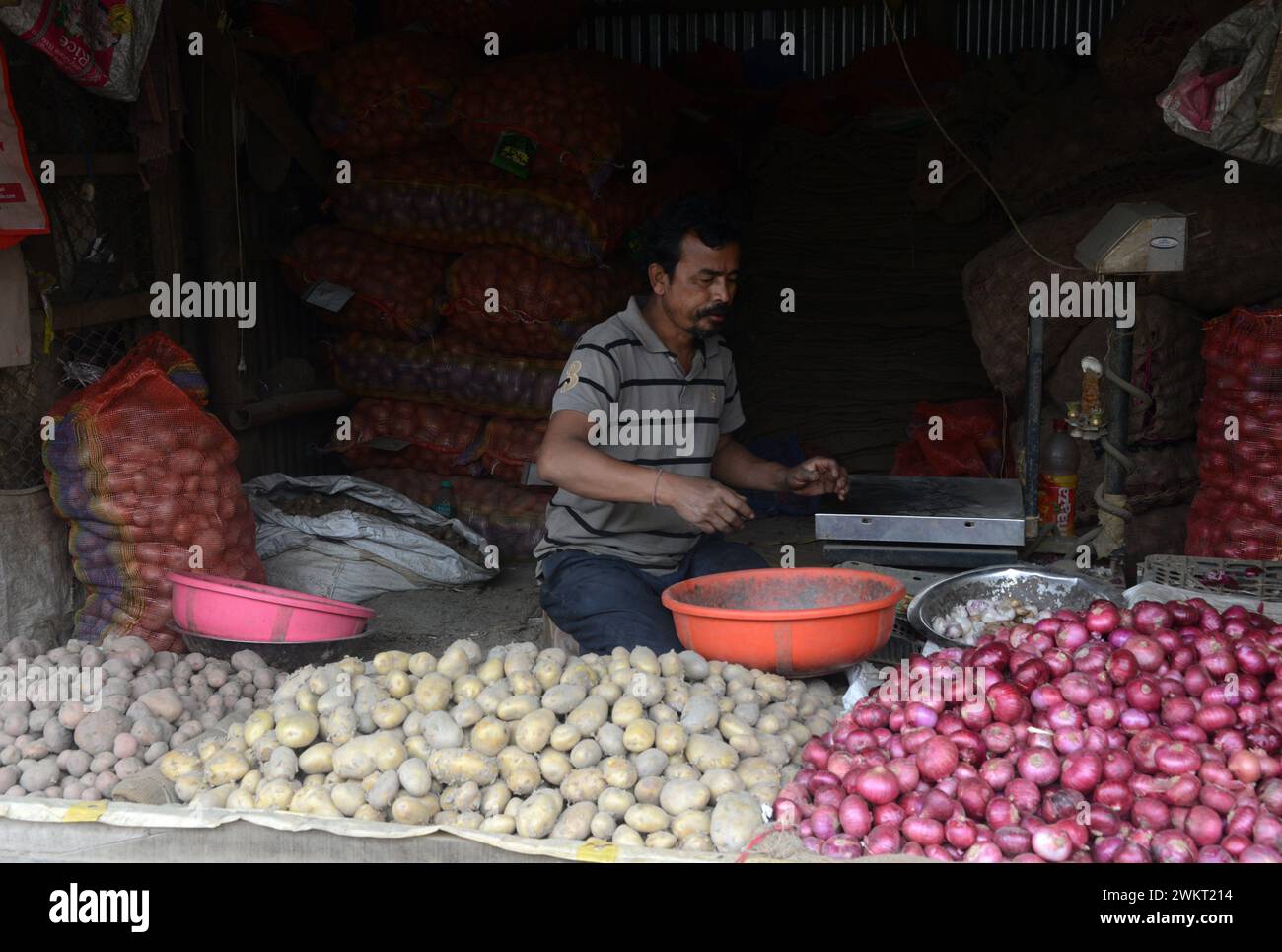Silguri, West Bengal, INDIA. 22nd Feb, 2024. An Indian vegetable vendor