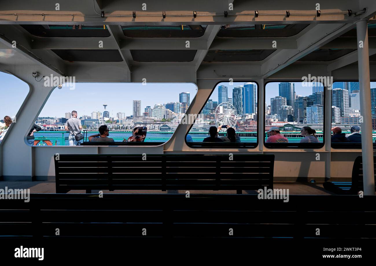 USA, Seattle, Washington State. Ferry passengers looking at downtown Seattle. Stock Photo
