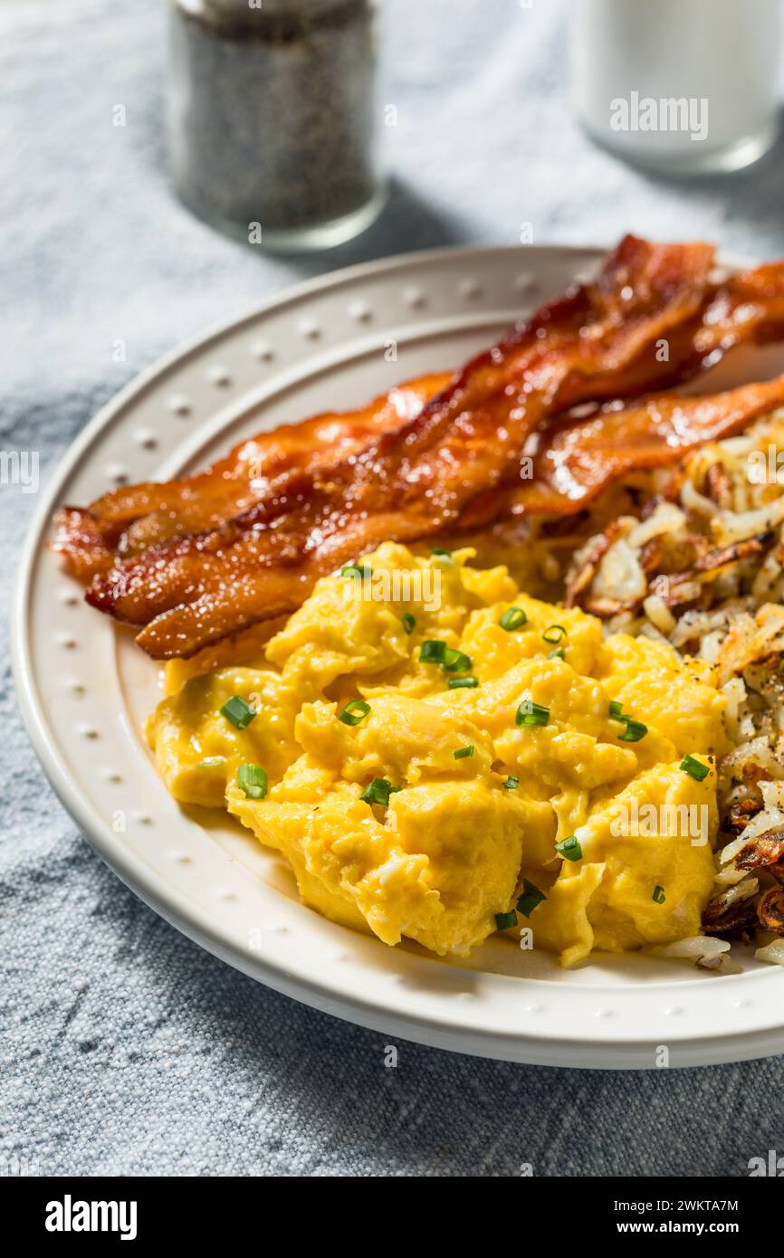 Healthy Homemade American Bacon Egg and Hashbrown Breakfast with Salt and Pepper Stock Photo