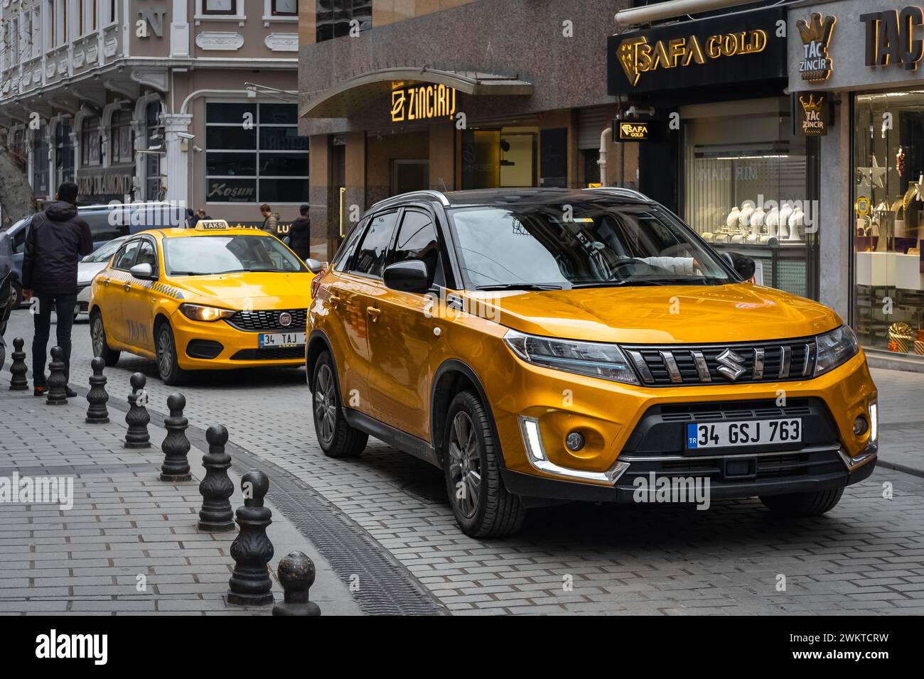 All-New Suzuki XL7 is a compact SUV produced by Suzuki in four generations. Orange Suzuki Grand Vitara is driving on the street of Istanbul Turkey-Dec Stock Photo